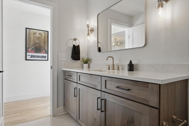 bathroom with baseboards and vanity