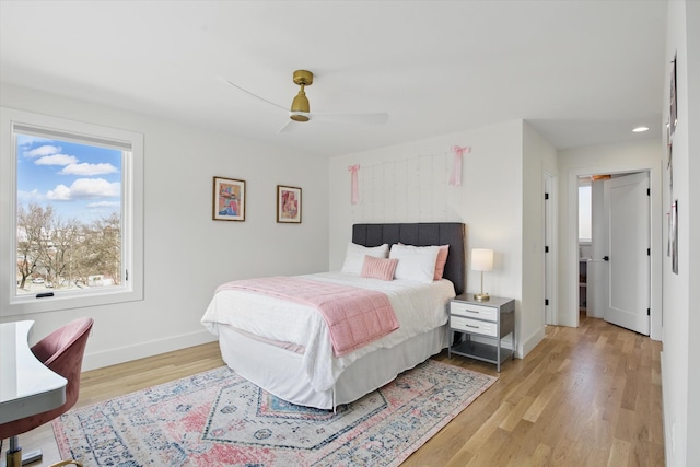 bedroom with light wood-style flooring, baseboards, a ceiling fan, and recessed lighting