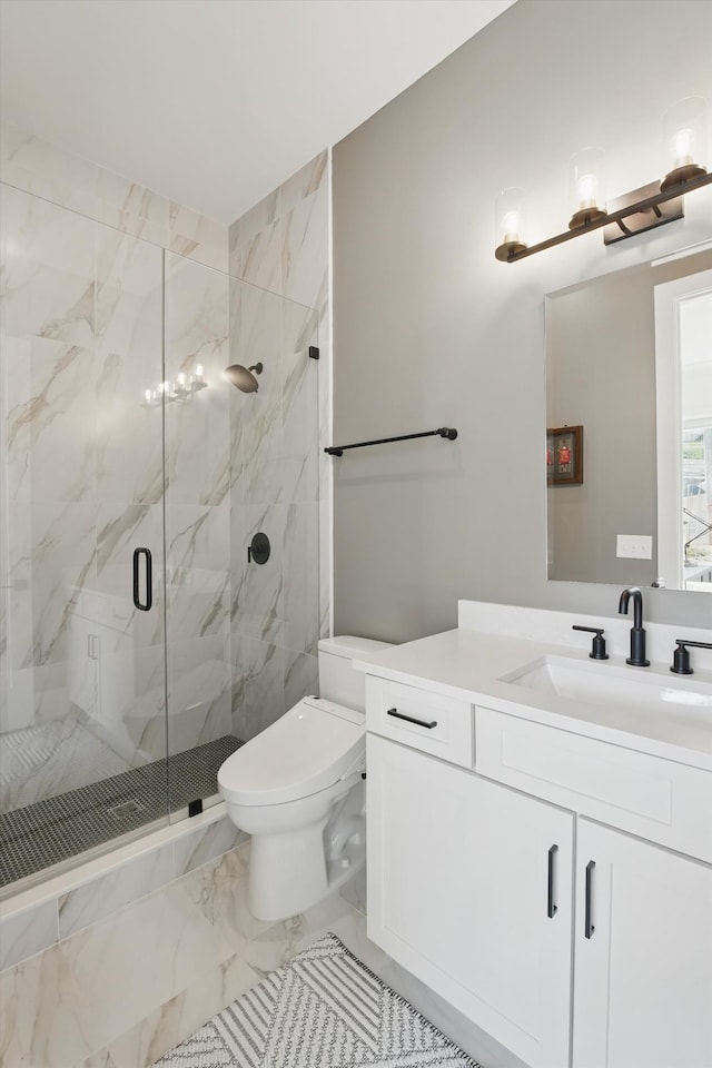 bathroom with toilet, marble finish floor, a marble finish shower, and vanity