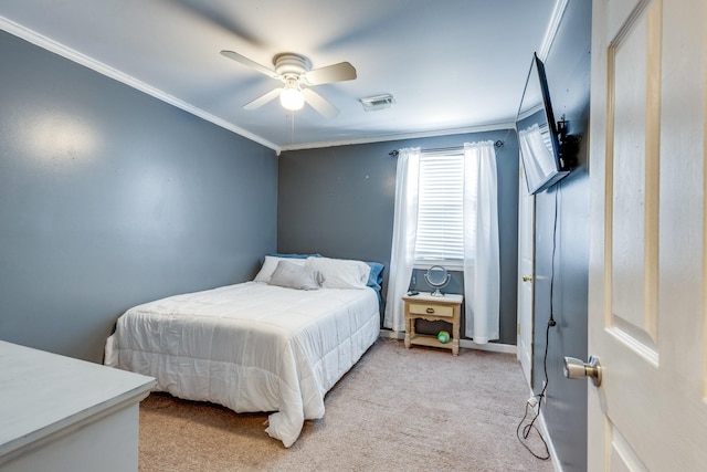 bedroom with carpet floors, a ceiling fan, baseboards, visible vents, and crown molding