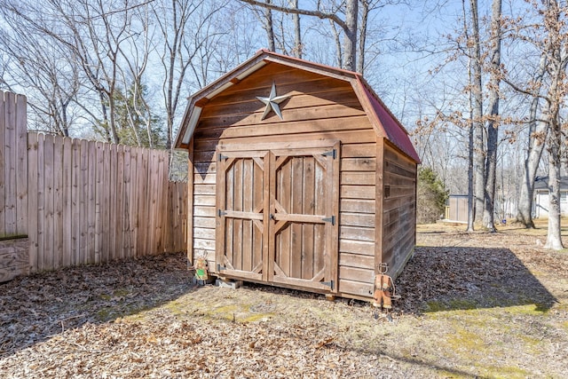 view of shed featuring a fenced backyard