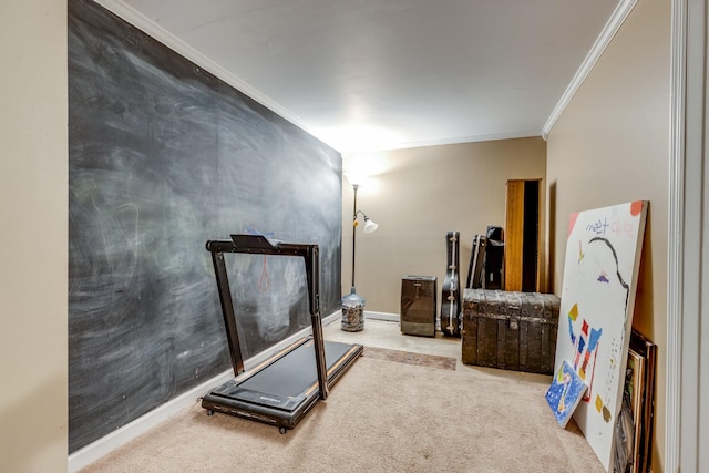 workout room with carpet floors and ornamental molding