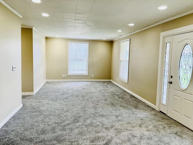 carpeted entrance foyer with ornamental molding, recessed lighting, and baseboards