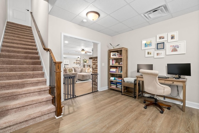 office area featuring a drop ceiling, wood finished floors, visible vents, and baseboards