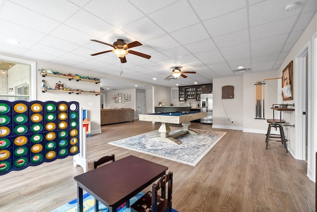 rec room with billiards, baseboards, a drop ceiling, and wood finished floors