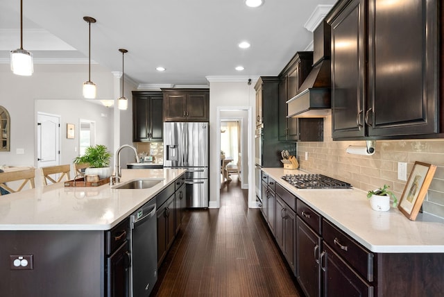 kitchen with stainless steel appliances, custom range hood, a sink, and crown molding