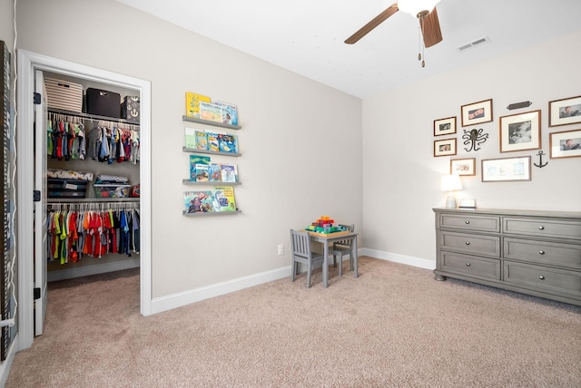 playroom featuring light carpet, visible vents, and baseboards