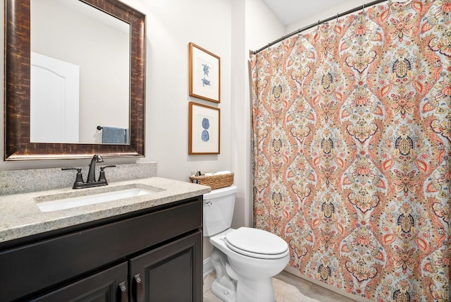 bathroom featuring toilet, tile patterned floors, a shower with curtain, and vanity