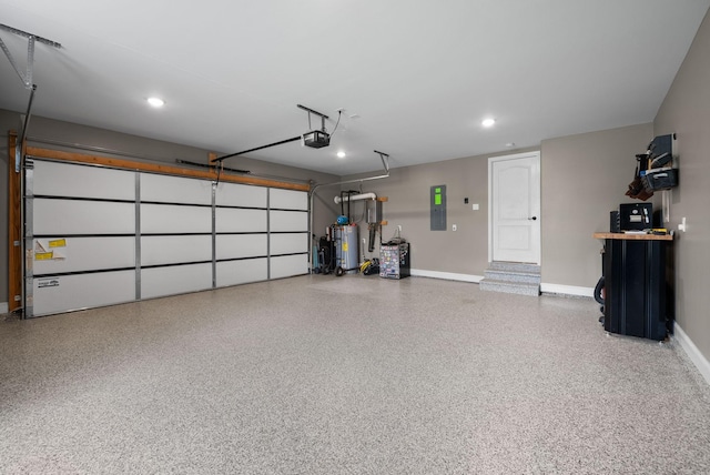 2425 Settlers Trce, Clarksville, TN 37043 - garage featuring water heater, baseboards, a garage door opener, and electric panel