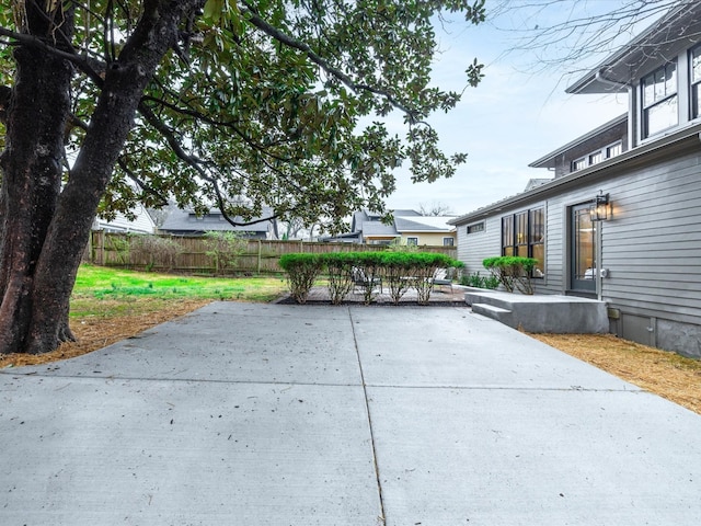 view of patio / terrace featuring fence