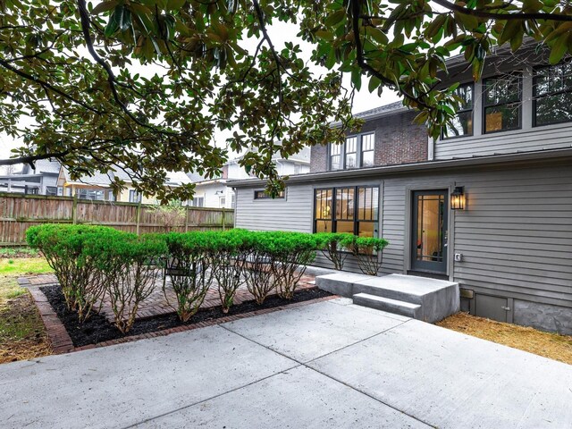 view of patio featuring fence