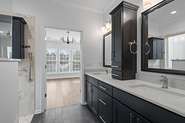 bathroom featuring crown molding, wood tiled floor, and a sink