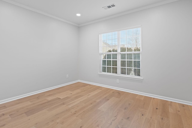 empty room with recessed lighting, visible vents, light wood-style floors, ornamental molding, and baseboards