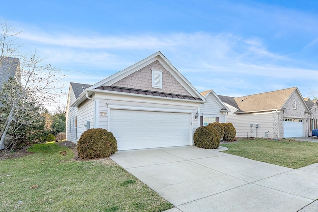 view of front of home featuring a garage, a front yard, a standing seam roof, and metal roof