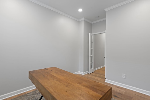 unfurnished office with recessed lighting, baseboards, wood finished floors, and ornamental molding