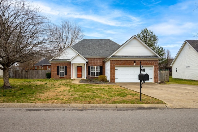 view of front facade with an attached garage, brick siding, fence, driveway, and a front lawn