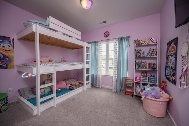 carpeted bedroom with baseboards and visible vents