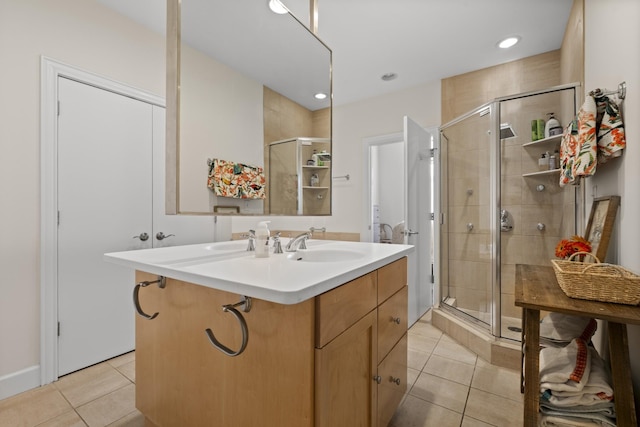 full bath featuring a stall shower, tile patterned flooring, vanity, and recessed lighting