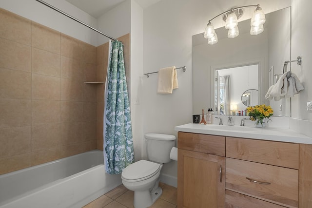 full bath with shower / bath combo, vanity, toilet, and tile patterned floors