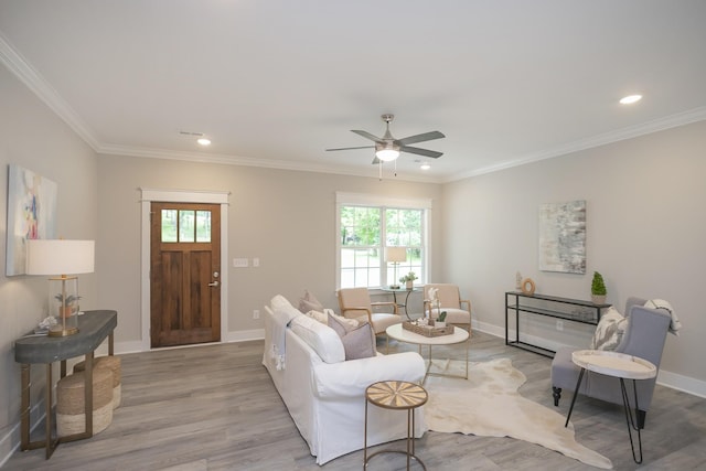 living room with baseboards, a wealth of natural light, and wood finished floors