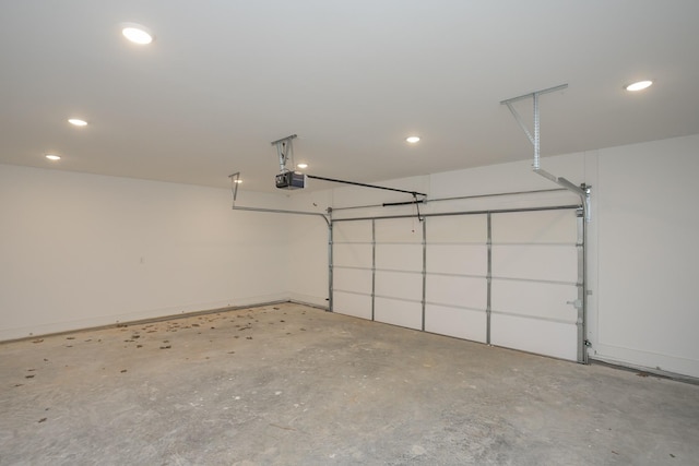 garage featuring a garage door opener and recessed lighting