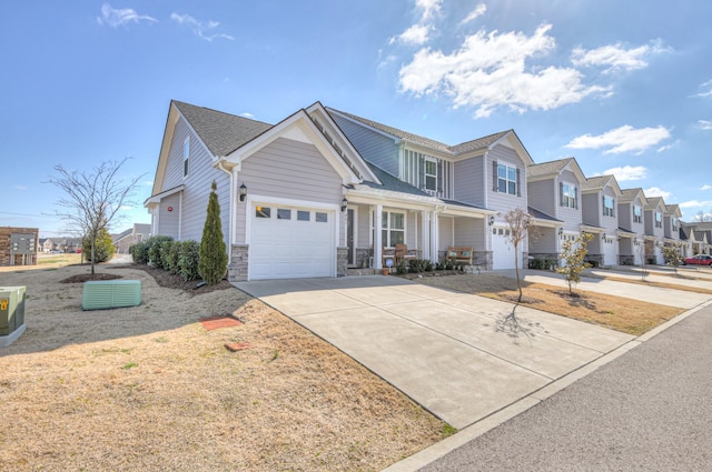 view of front of house featuring stone siding, concrete driveway, and a residential view