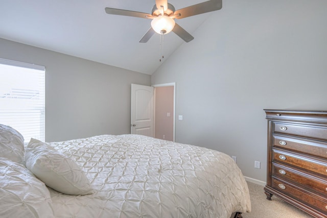 carpeted bedroom featuring vaulted ceiling, baseboards, and ceiling fan