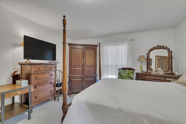 carpeted bedroom featuring a textured ceiling