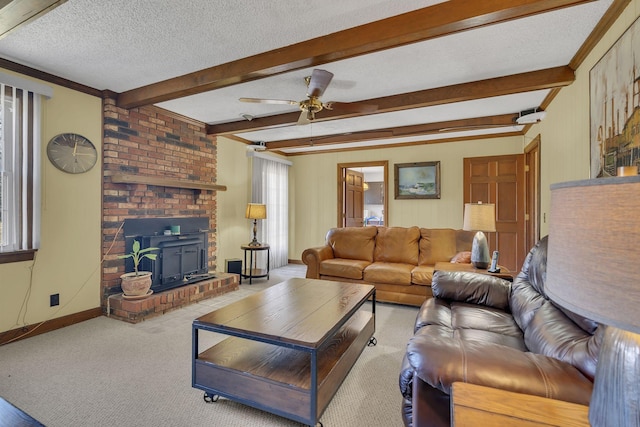 living area featuring a textured ceiling, carpet, beam ceiling, and baseboards