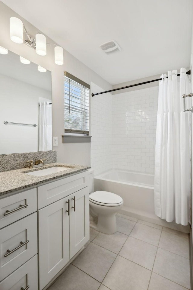 full bath featuring toilet, vanity, visible vents, tile patterned floors, and shower / bath combination with curtain