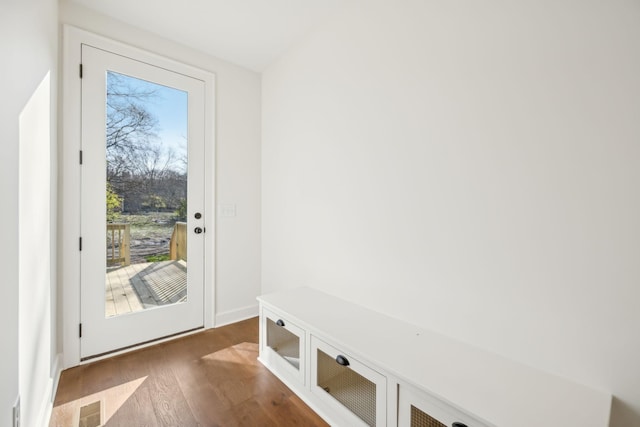 doorway to outside featuring visible vents and wood finished floors