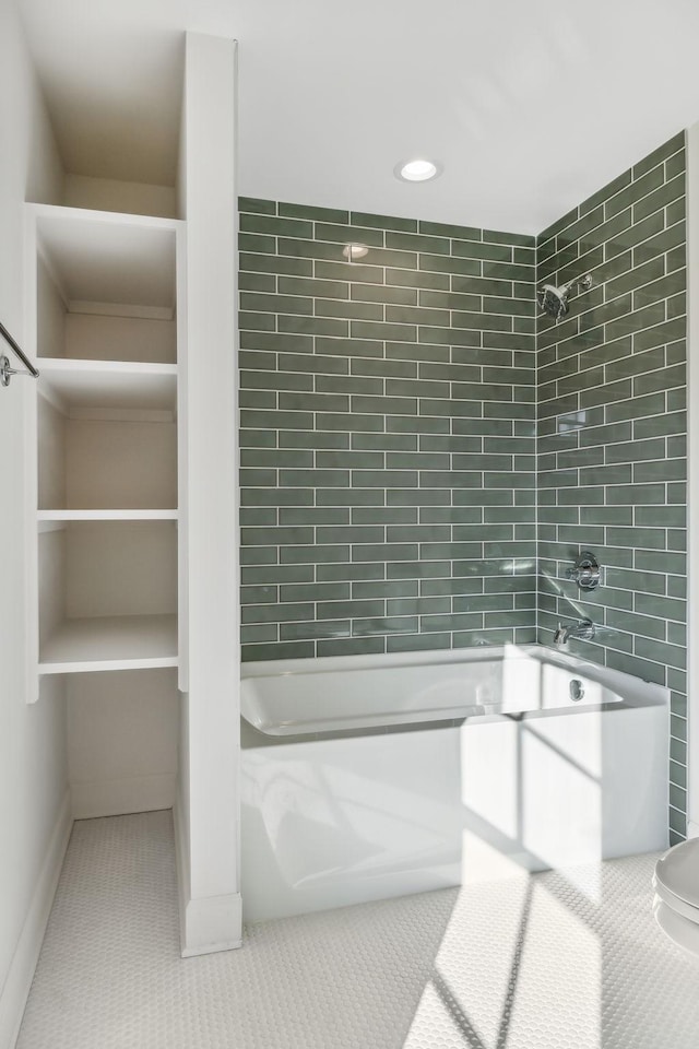 bathroom featuring shower / bathtub combination, tile walls, and tile patterned floors