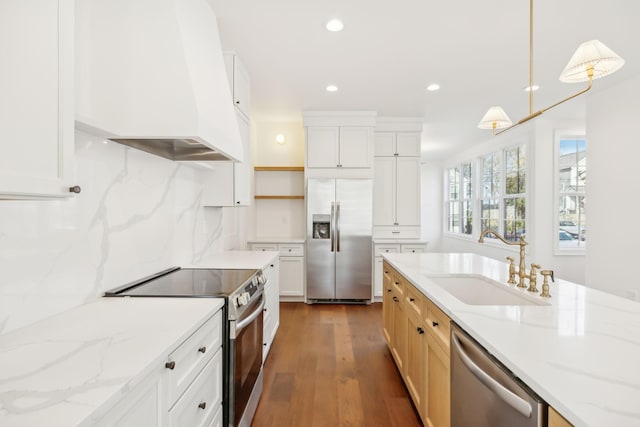 kitchen with open shelves, stainless steel appliances, tasteful backsplash, a sink, and premium range hood