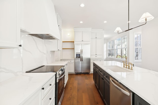 kitchen featuring open shelves, stainless steel appliances, white cabinets, a sink, and premium range hood