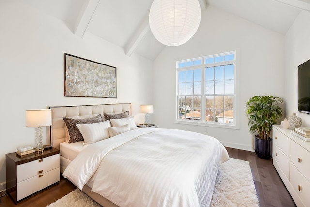 bedroom featuring lofted ceiling with beams, dark wood-style floors, and baseboards