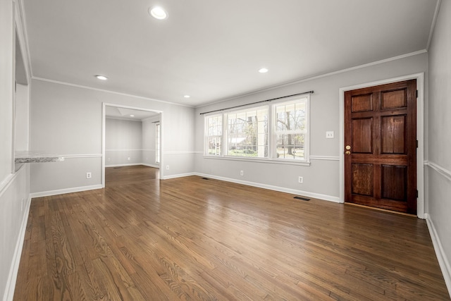 empty room featuring recessed lighting, crown molding, and wood finished floors