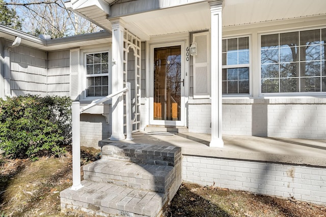 property entrance with brick siding