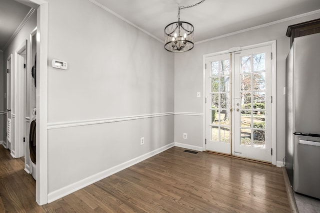 interior space featuring dark wood-style floors, baseboards, and crown molding