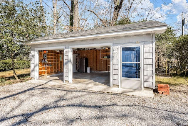 detached garage with freestanding refrigerator