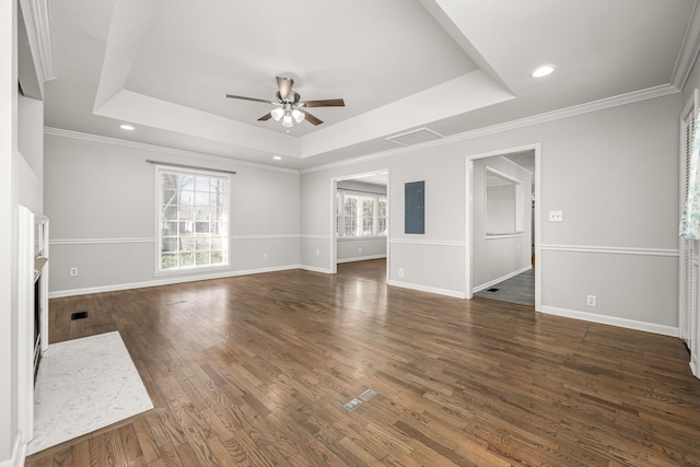 unfurnished living room featuring ceiling fan, wood finished floors, a raised ceiling, and baseboards