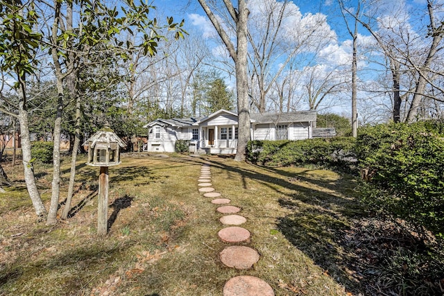 view of front of home with a front yard