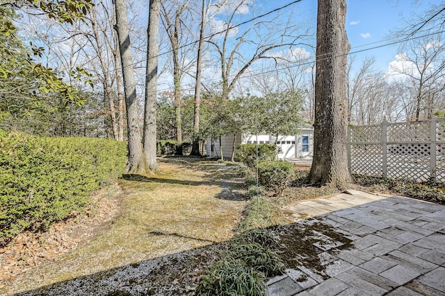 view of yard with a patio and fence