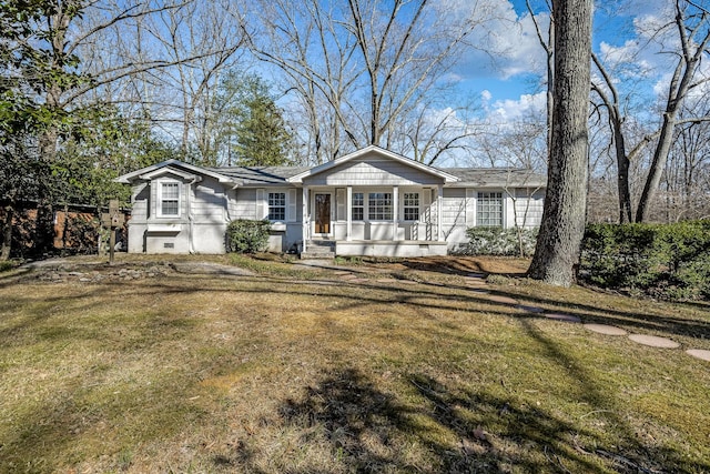 view of front of home with a front lawn and crawl space