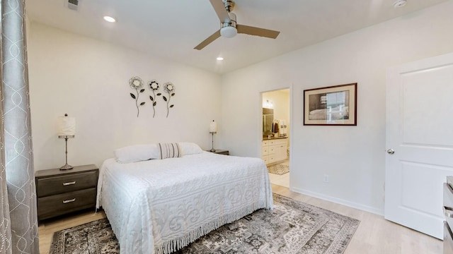 bedroom with recessed lighting, a ceiling fan, baseboards, light wood finished floors, and ensuite bath