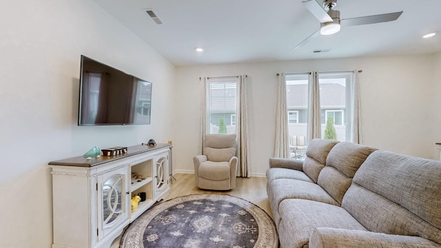 living area featuring recessed lighting, wood finished floors, visible vents, and a ceiling fan