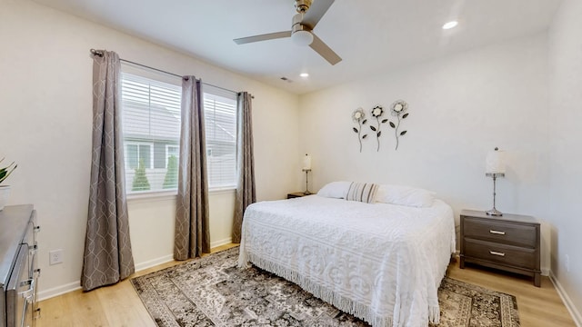 bedroom featuring light wood finished floors, ceiling fan, baseboards, and recessed lighting