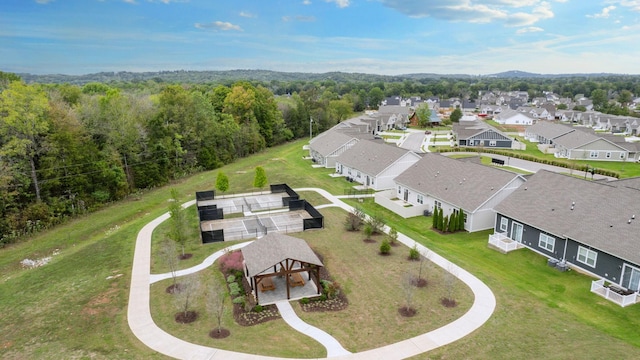 birds eye view of property with a residential view