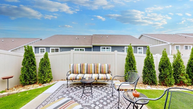 view of patio / terrace featuring an outdoor hangout area and a fenced backyard