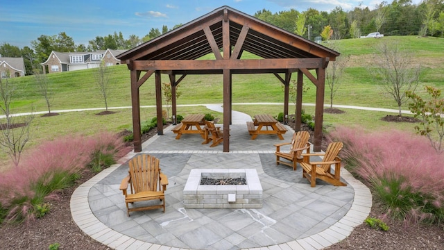 view of patio featuring an outdoor fire pit and a gazebo