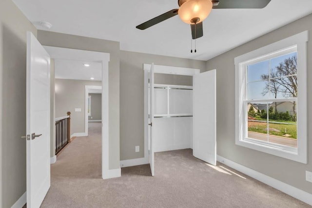 919 Licinius Ln, Murfreesboro, TN 37128 - unfurnished bedroom featuring a closet, baseboards, a ceiling fan, and light carpet